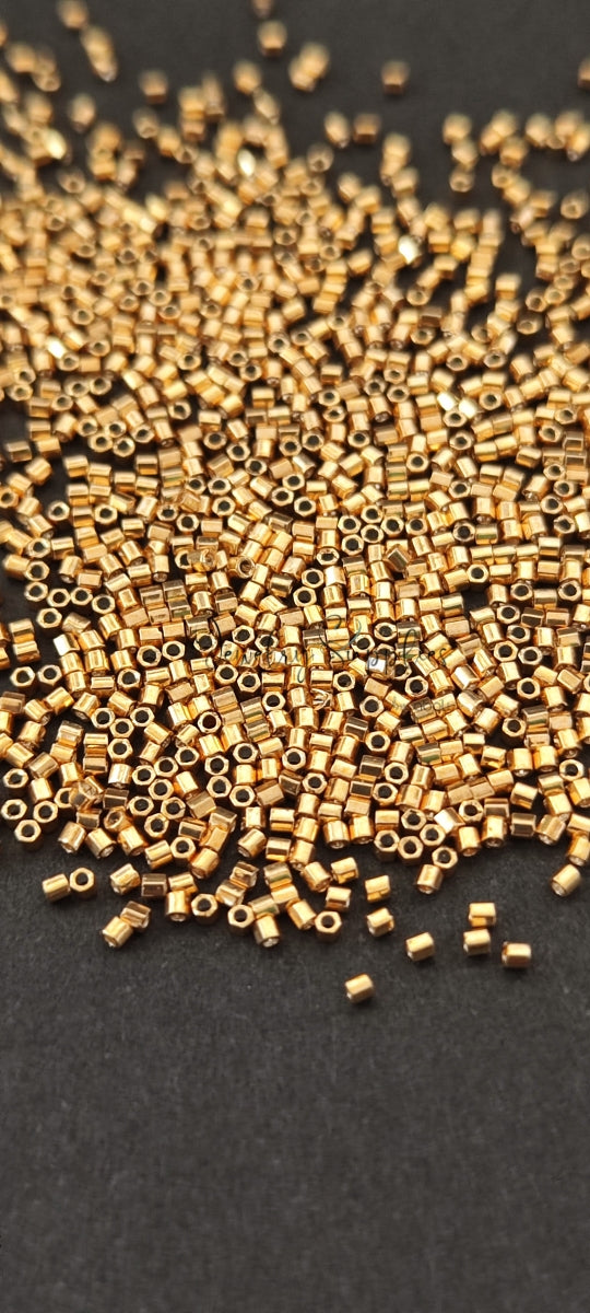 Close-up of Miyuki Delica Beads Size 15/0 Galvanized Gold (182) Hex cut MDSBGG15 3 gm