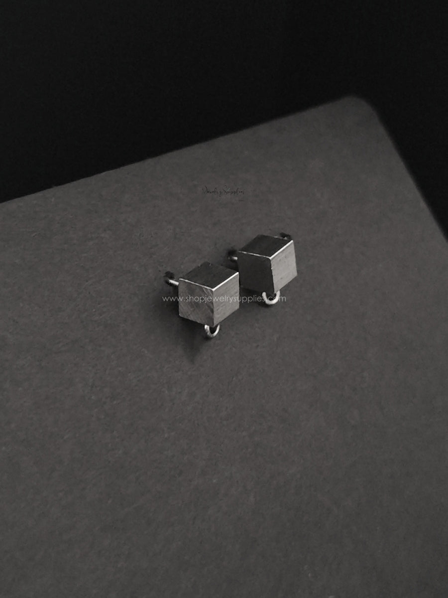 Pair of geometric silver earrings box shaped earring studs