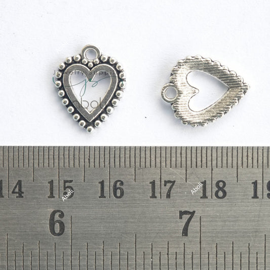 Silver heart with open frame charm with beaded motif outline CHMS162