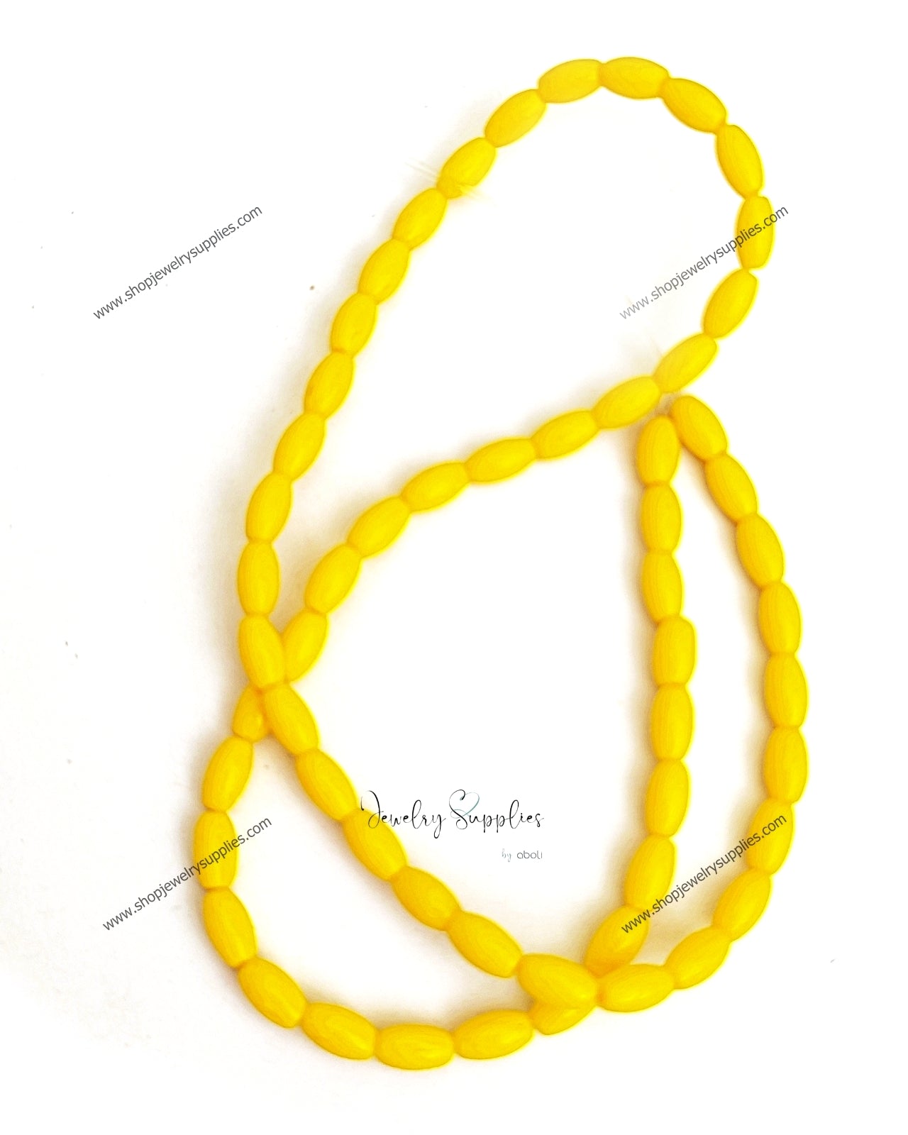 Yellow glass beads oval 8 x 4 mm OGB03 1 full strand