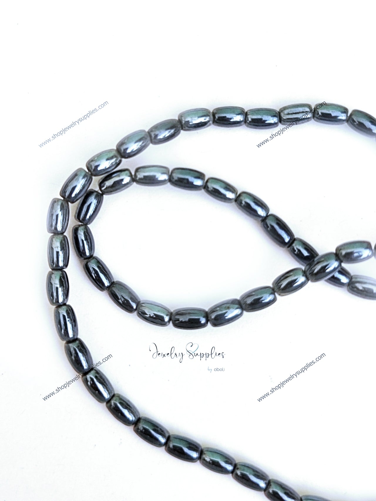 Black glass beads oval hematite finish 8 x 4 mm OGB05 1 full strand