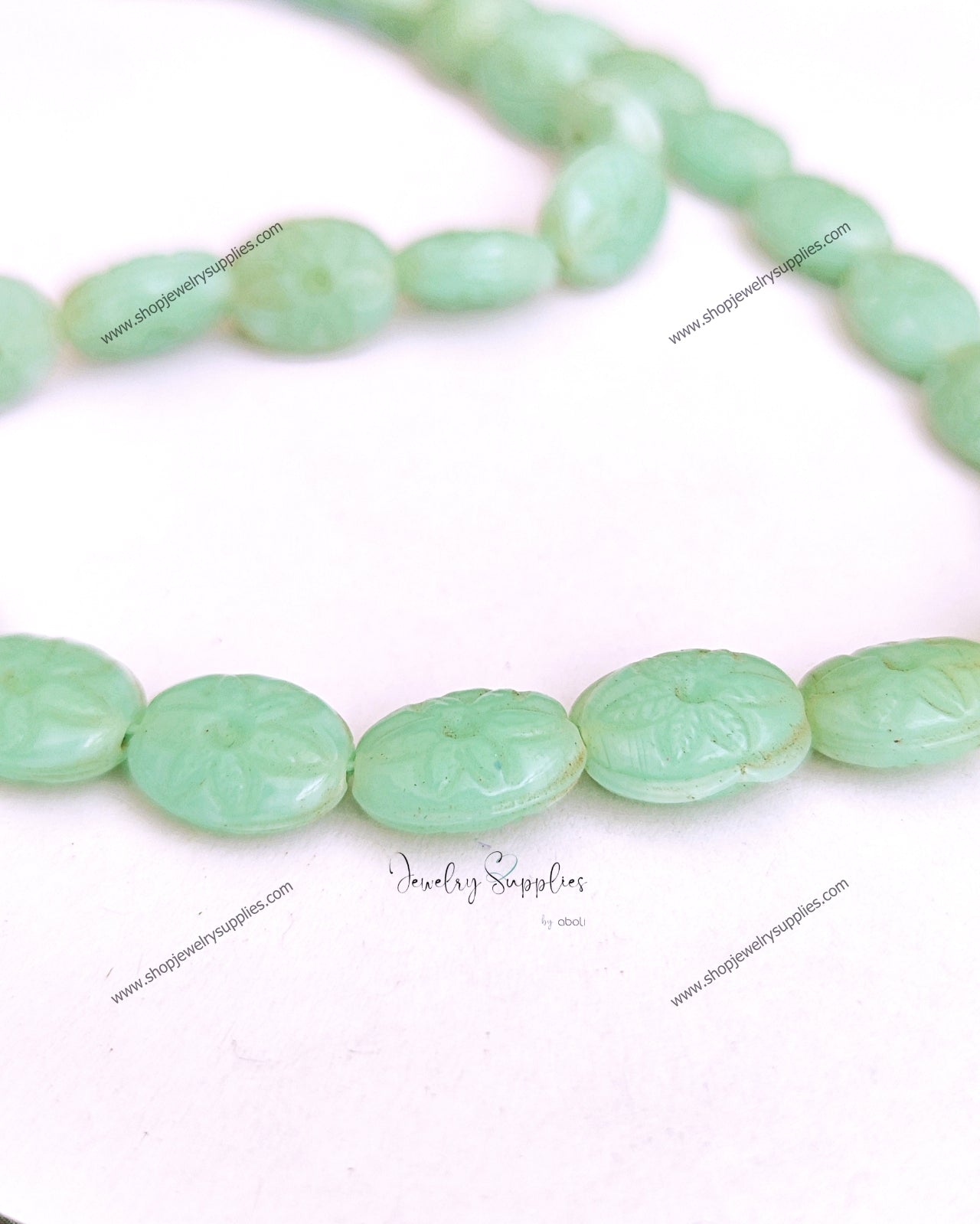 Carved oval beads synthetic glass beads mint colour 14 x 11 x 6 mm GBD211 10 beads