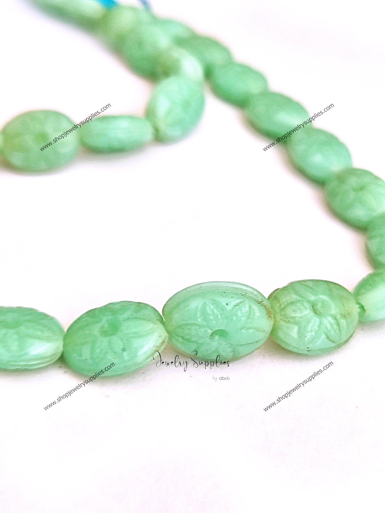 Carved oval beads synthetic glass beads mint colour 14 x 11 x 6 mm GBD211 10 beads